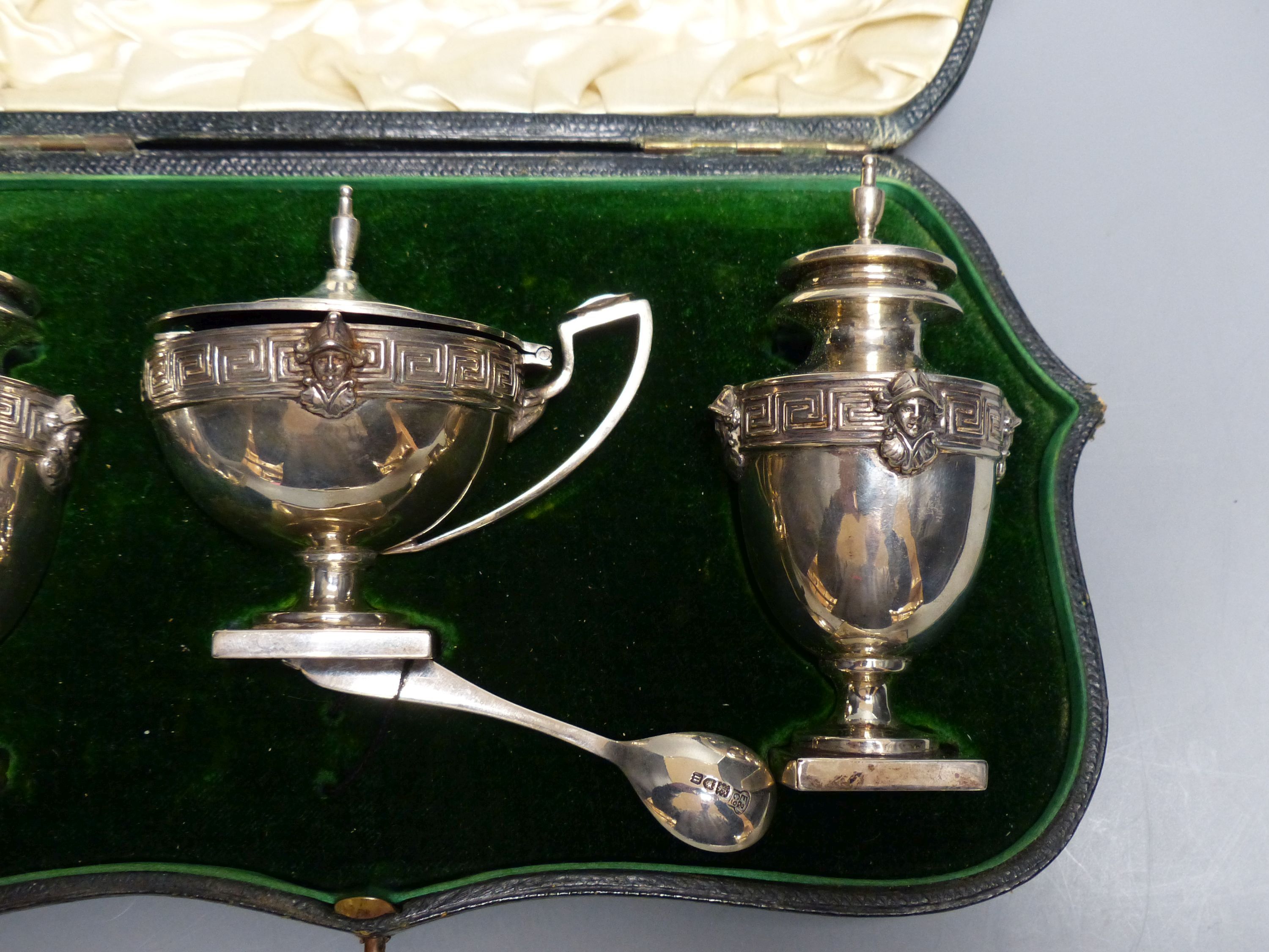 A cased Edwardian silver three piece condiment set